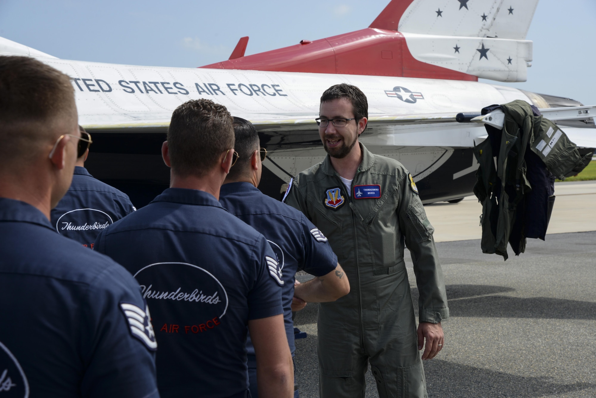Andrew Jackson, radio host for 88.7 The Bridge, shakes hands with members of the U.S.A.F. Thunderbirds after a media flight Aug. 25, 2017, during the Thunder Over Dover Open House at Dover Air Force Base, Del. Jackson said he was extremely grateful for the experience and thanked the Thunderbirds for their service and professionalism. (U.S. Air Force photo by Staff Sgt. Aaron J. Jenne)