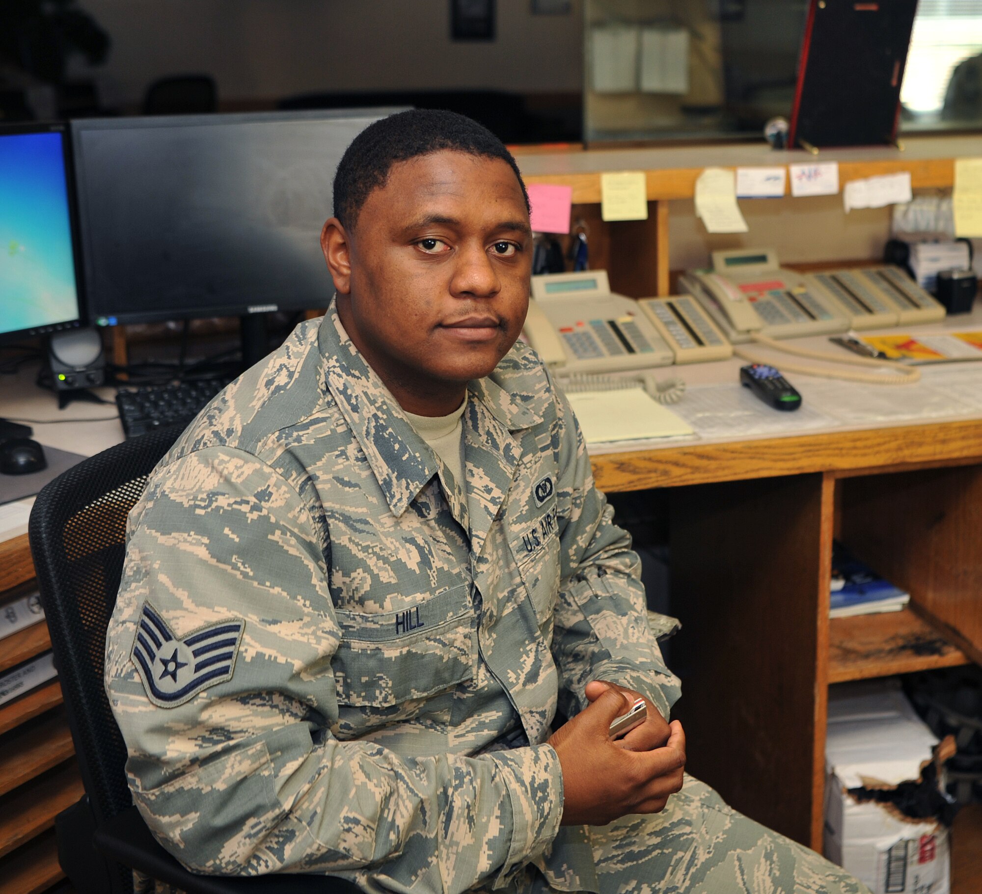 Staff Sgt. Michael Hill, 9th Operations Support Squadron airfield management operations supervisor, poses for a photo