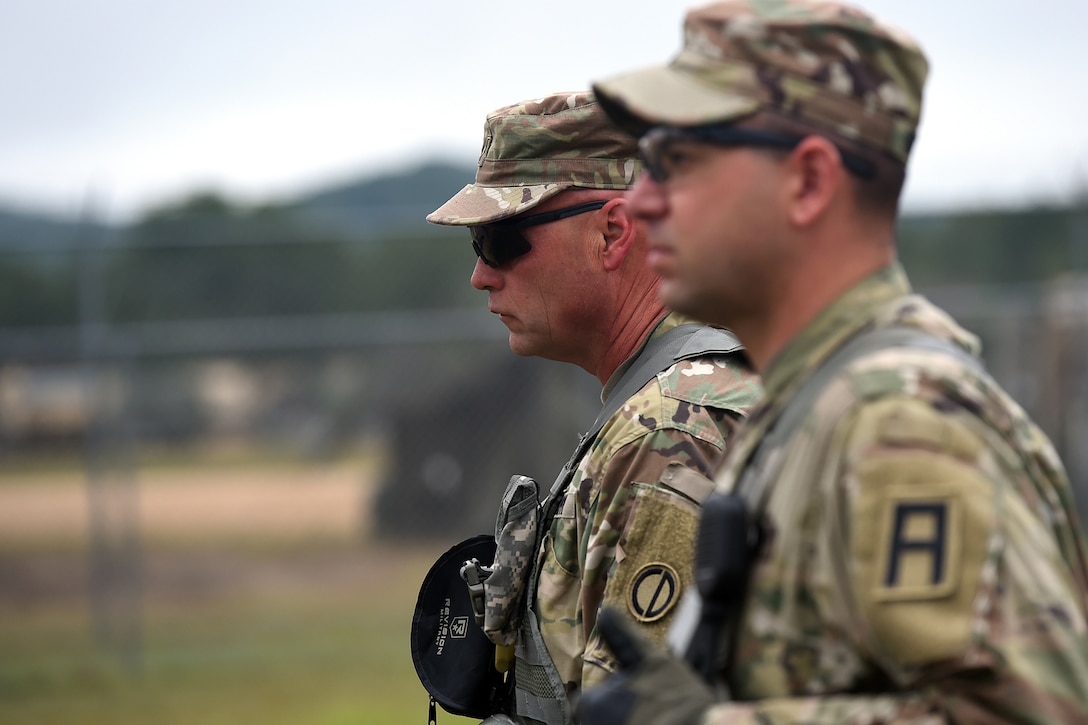 Army Reserve Chief Warrant Officer 5 Eric Nordy, left, Command Chief Warrant Officer, 85th Support Command, observes military police riot control training at a mock detention facility during Combat Support Training Exercise 86-17-02 at Fort McCoy, Wisconsin, from August 5 – 25, 2017.