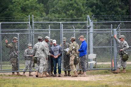 Army Reserve Military Police in-process a detainee at an entry control point in a mock detention facility during Combat Support Training Exercise 86-17-02 at Fort McCoy, Wisconsin, from August 5 – 25, 2017.