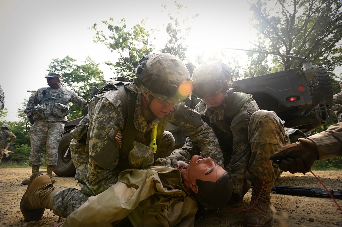 Army Reserve Soldiers assigned to the 693rd Quartermaster Company, Bell, California, treat a casualty after an ambush during Combat Support Training Exercise 86-17-02 at Fort McCoy, Wisconsin, from August 5 – 25, 2017.