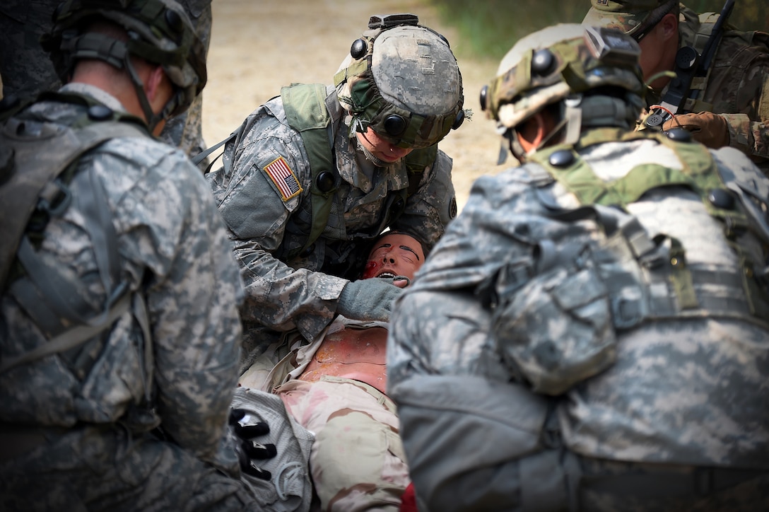 Army Reserve Soldiers assigned to the 693rd Quartermaster Company, Bell, California, treat a casualty after an ambush during Combat Support Training Exercise 86-17-02 at Fort McCoy, Wisconsin, from August 5 – 25, 2017.