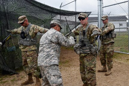 Army Reserve Sgt. David Kim, assigned to the 822nd Military Police Company, Arlington Heights, Illinois, conducts a pat-down search at an entry control point in a mock detention facility during Combat Support Training Exercise 86-17-02 at Fort McCoy, Wisconsin, from August 5 – 25, 2017.