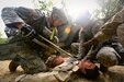 Army Reserve Soldiers assigned to the 693rd Quartermaster Company, Bell, California, treat a casualty after an ambush during Combat Support Training Exercise 86-17-02 at Fort McCoy, Wisconsin, from August 5 – 25, 2017.
