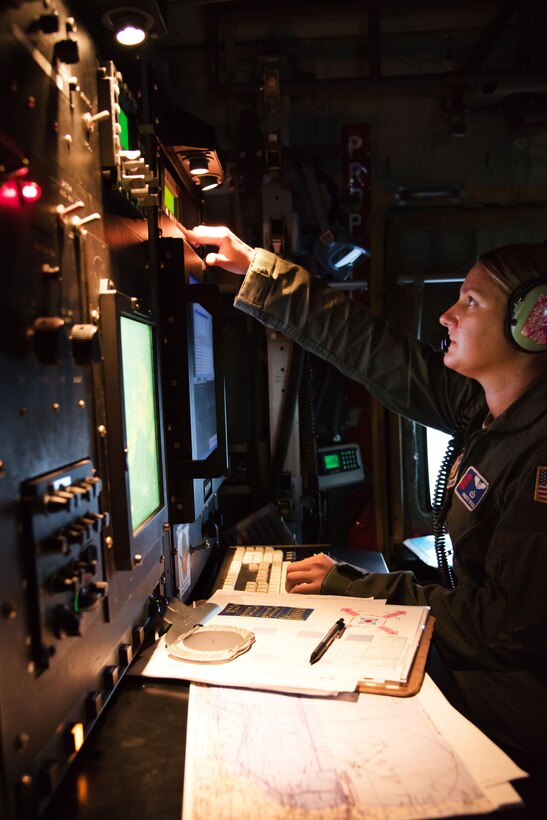 Air Force Maj. Kimberly Spusta collects weather data for the National Hurricane Center.