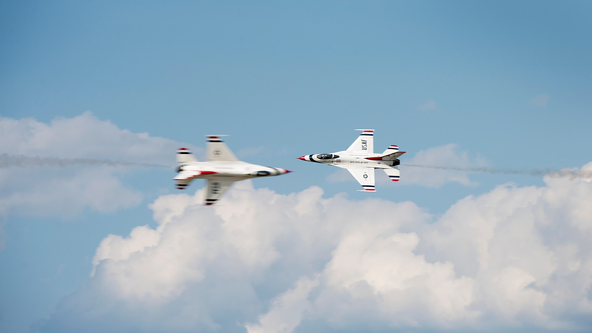 The U.S. Air Force Thunderbirds perform an opposing knife edge pass over Dover Air Force Base, Del., during the Thunder Over Dover Open House Aug. 26, 2017. The Thunderbirds demonstrated the versatility of the F-16 Fighting Falcon by performing aerial acrobatics, precision formations and high-speed passes during their performance. (U.S. Air Force photo by Senior Airman Zachary Cacicia)