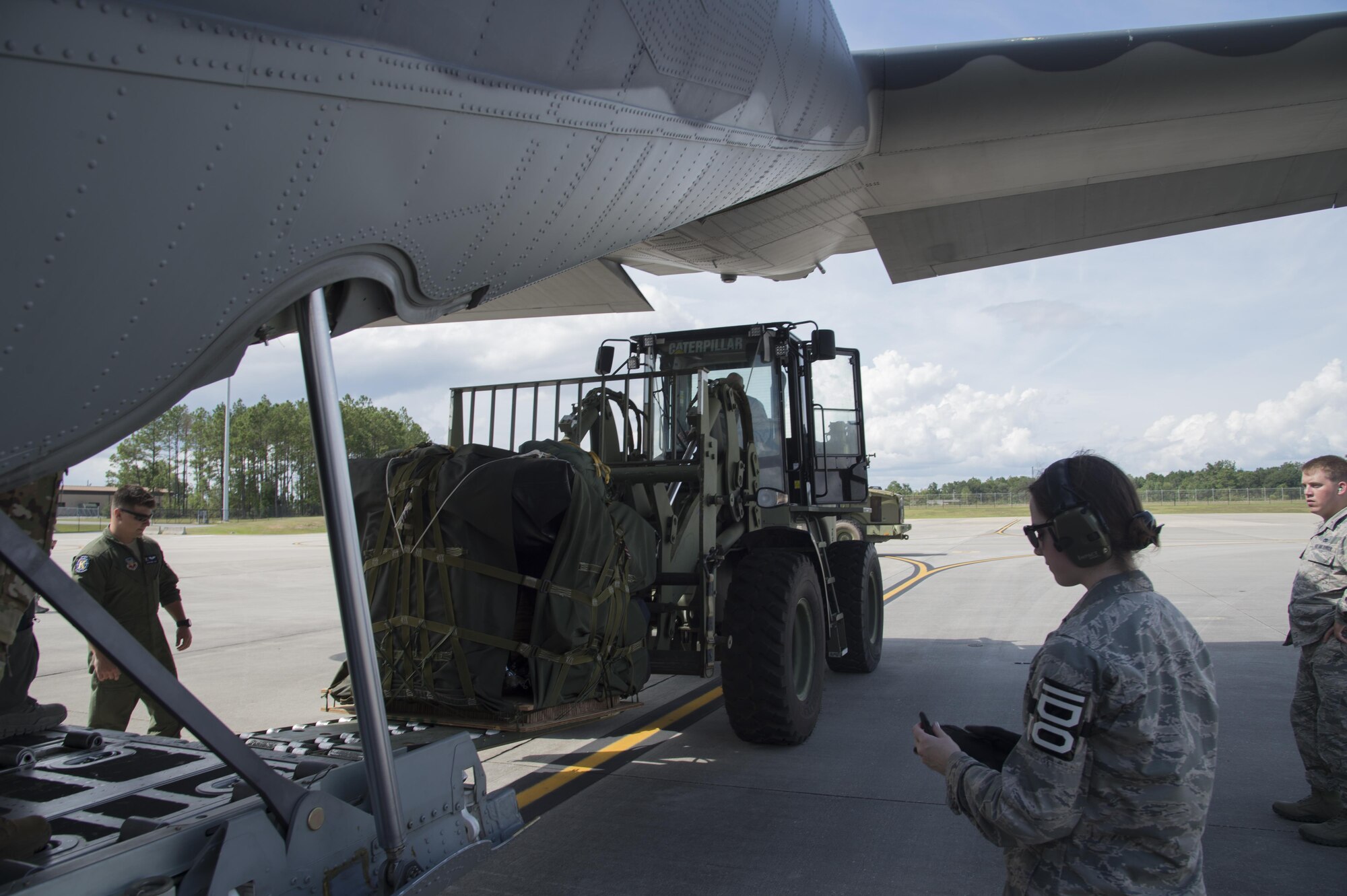 U.S. Air Force members from the 71st Rescue Squadron load gear and equipment in to an HC-130J Combat King II traveling to Texas in preparation of possible hurricane relief support August 26, 2017, at Moody Air Force Base, Ga.