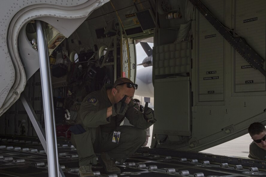 A U.S. Air Force loadmaster from the 71st Rescue Squadron guides a forklift carrying cargo to be loaded onto an HC-130J Combat King II. August 26, 2017, at Moody Air Force Base, Ga.