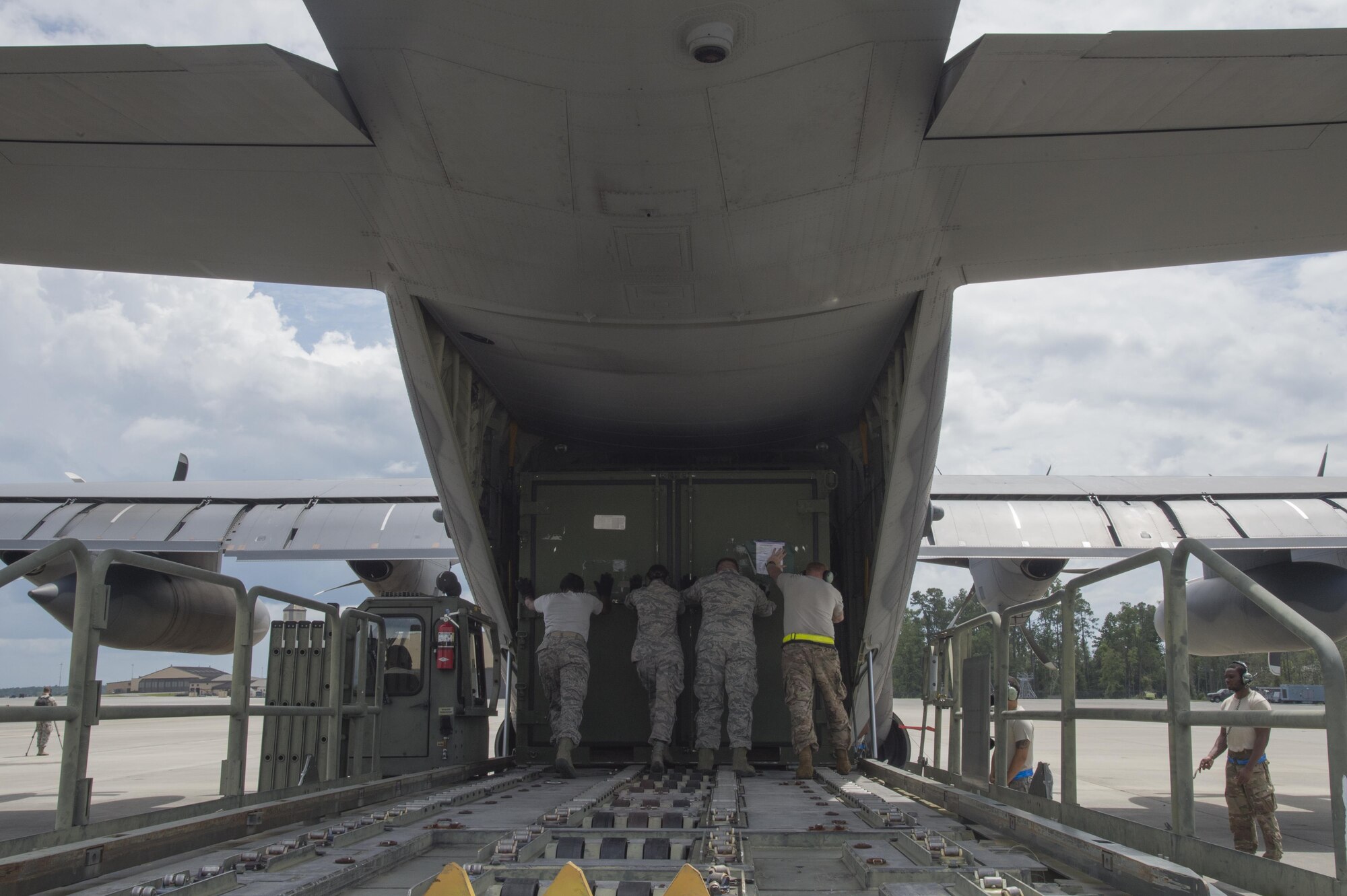 U.S. Air Force members from the 71st Rescue Squadron load gear and equipment in to an HC-130J Combat King II traveling to Texas in preparation of possible hurricane relief support August 26, 2017, at Moody Air Force Base, Ga.