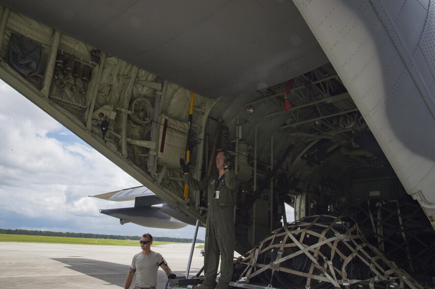 A U.S. Air Force loadmaster from the 71st Rescue Squadron guides a forklift carrying cargo to be transported to Texas in preparation of possible hurricane relief support August 26, 2017, at Moody Air Force Base, Ga.