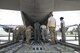 U.S. Air Force members from the 71st Rescue Squadron push a storage container on to a HC-130J Combat King II traveling to Texas in preparation of possible hurricane relief support August 26, 2017, at Moody Air Force Base, Ga. The 23d Wing launched HC-130J Combat King IIs, HH-60G Pavehawks, aircrew and other support personnel to preposition aircraft and airmen, if tasked to support Hurricane Harvey relief operations. (U.S. Air Force photo by Staff Sgt. Eric Summers Jr.)
