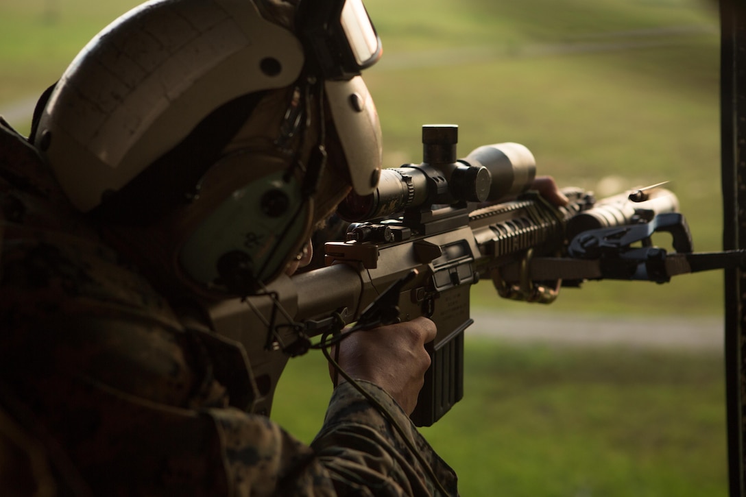 U.S. Marine Corps Sgt. Matthew T. Takojeff, a scout sniper with the Battalion Landing Team 2nd Battalion, 6th Marine Regiment, 26th Marine Expeditionary Unit (MEU), fires an M110 Semi-Automatic Sniper System at a simulated target during aerial sniper training near Marine Corps Air Station New River, N.C., Aug. 19, 2017.