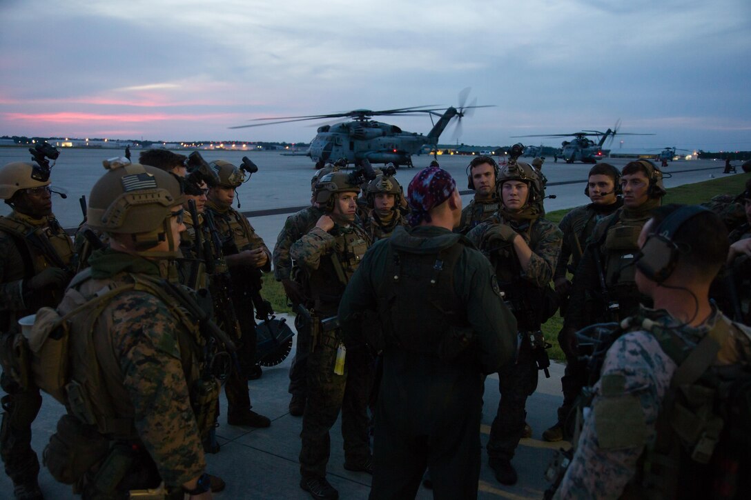 U.S. Marines with the Maritime Raid Force, 26th Marine Expeditionary Unit (MEU), prepare to conduct a night raid operation during Realistic Urban Training (RUT) at Marine Corps Air Station New River, N.C., Aug. 25, 2017.