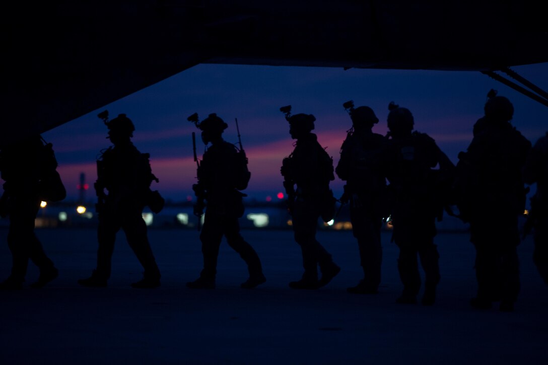 U.S. Marines with the Maritime Raid Force, 26th Marine Expeditionary Unit (MEU), board a CH-53E Super Stallion helicopter with Marine Medium Tiltrotor Squadron 162 (Reinforced), prior to conducting a night raid operation during Realistic Urban Training (RUT) at Marine Corps Air Station New River, N.C., Aug. 25, 2017.