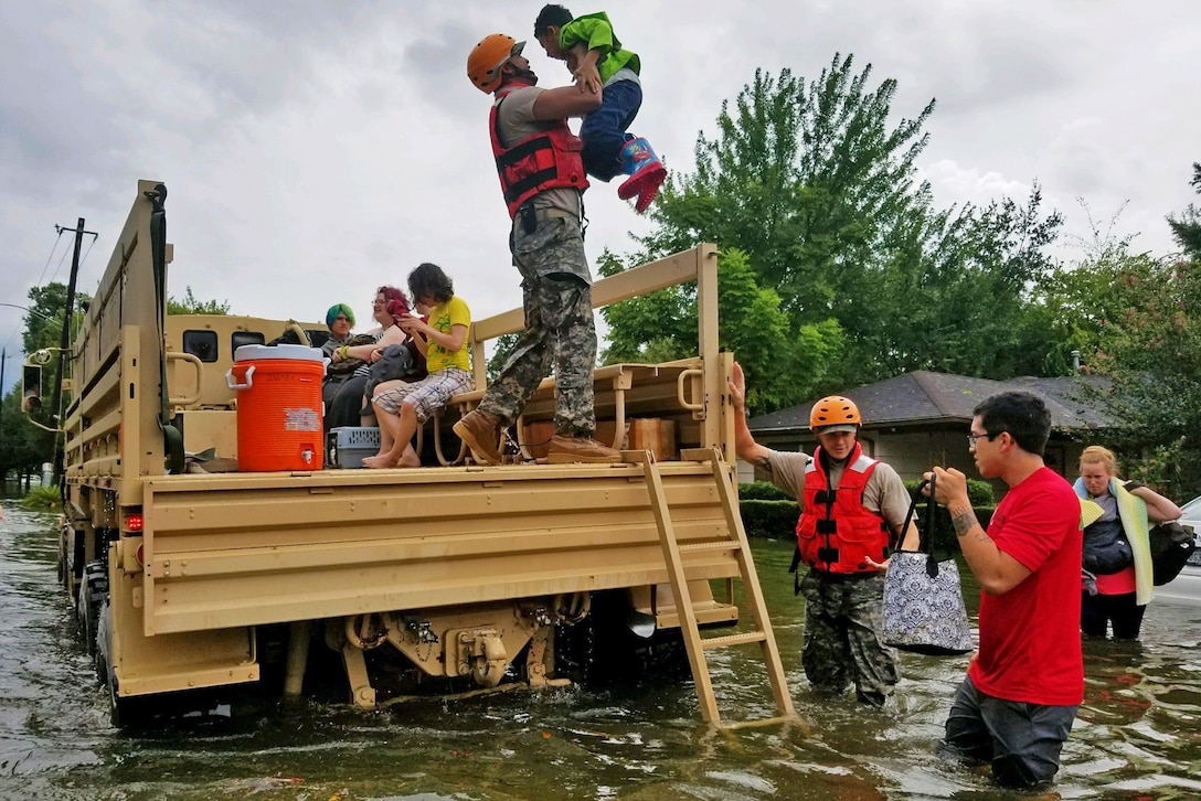 Texas National Guard soldiers assist residents affected by flooding caused by Hurricane Harvey in Houston, Aug. 27, 2017. National Guard photo by Lt. Zachary West