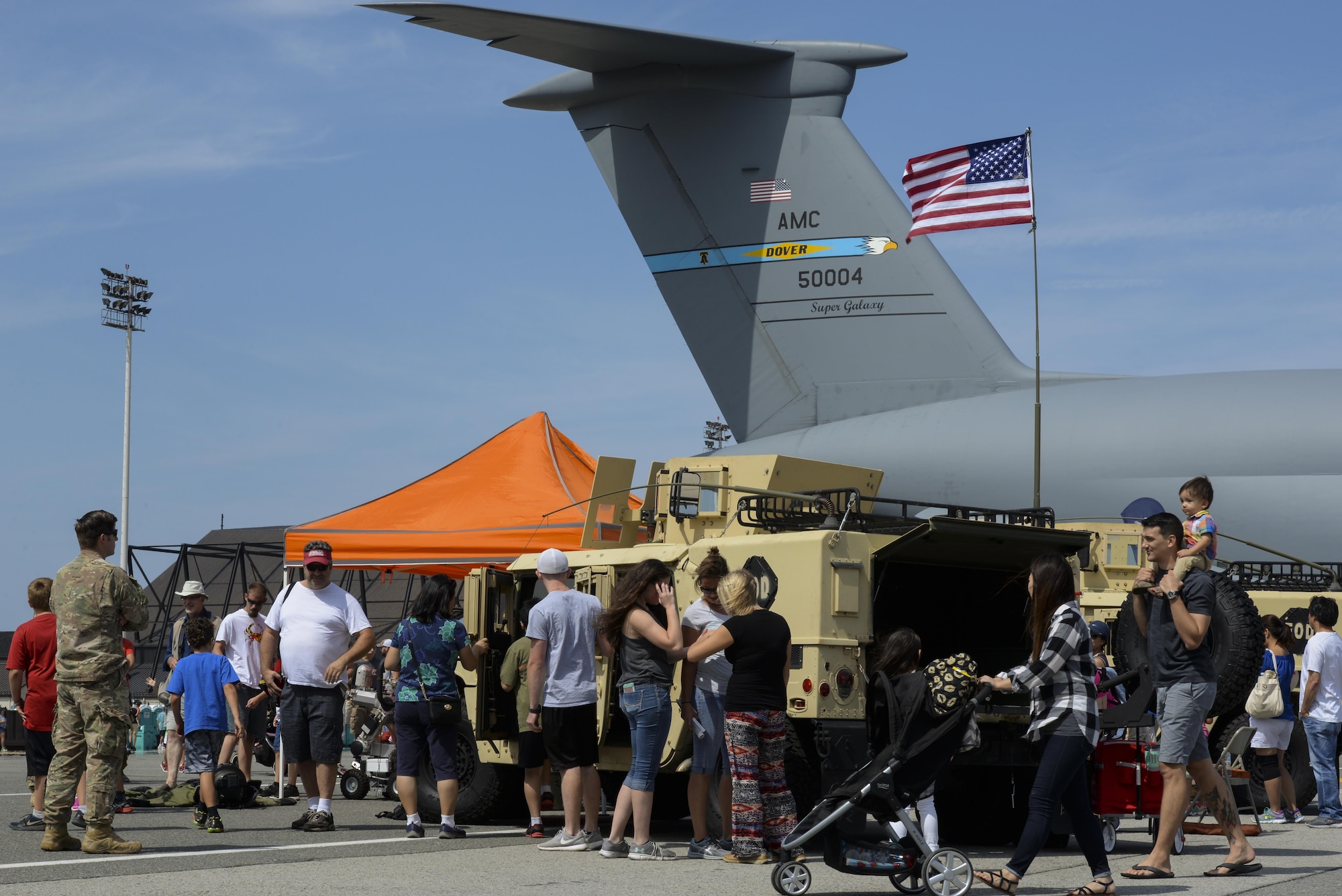 Guests of Team Dover interact with explosive ordnance disposal technicians from the 436th Civil Engineer Squadron Aug. 27, 2017, during the Thunder Over Dover Open House on Dover Air Force Base, Del. The open house showcased a spectrum of American air power from World War II to present day. (U.S. Air Force photo by Staff Sgt. Aaron J. Jenne)