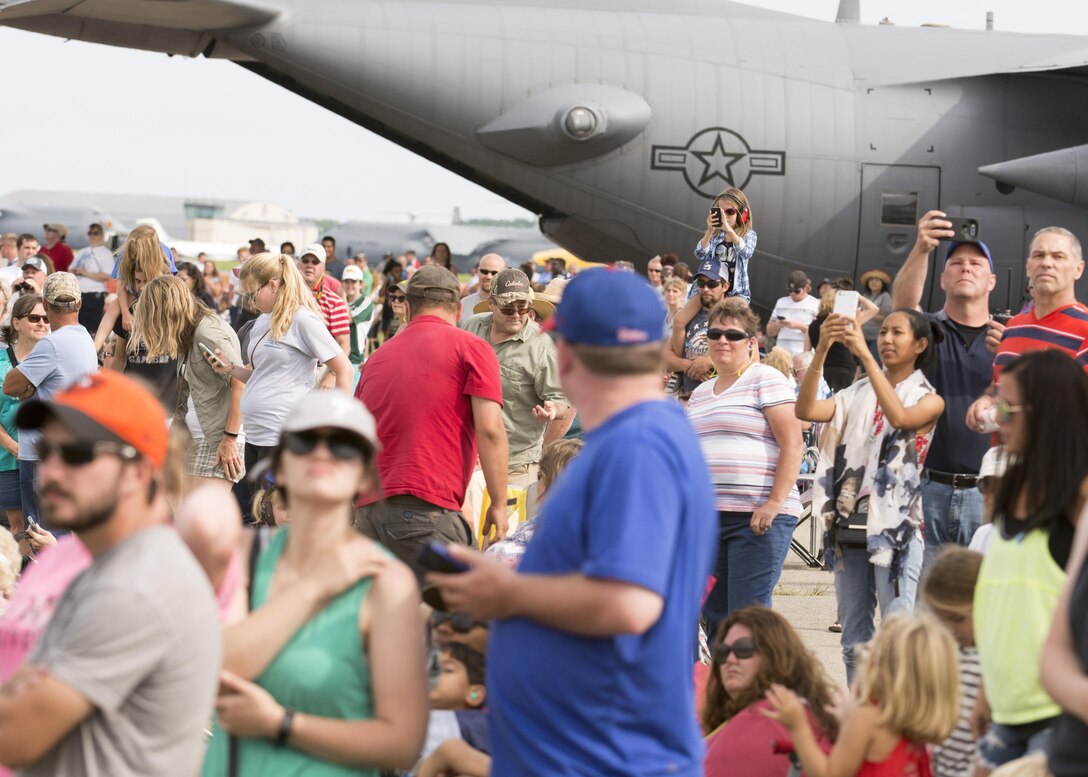 Team Dover guests watch as the Thunderbirds begin their aerial performance during the 2017 Thunder Over Dover Open House Aug. 27, 2017, on Dover AFB, Del. The Thunderbirds are the Air Force’s premier aerial demonstration team, led by Lt. Col. Jason Heard, commander/leader of the U.S. Air Force Air Demonstration Squadron and pilot of the No. 1 jet. (U.S. Air Force photo by Staff Sgt. Jared Duhon)
