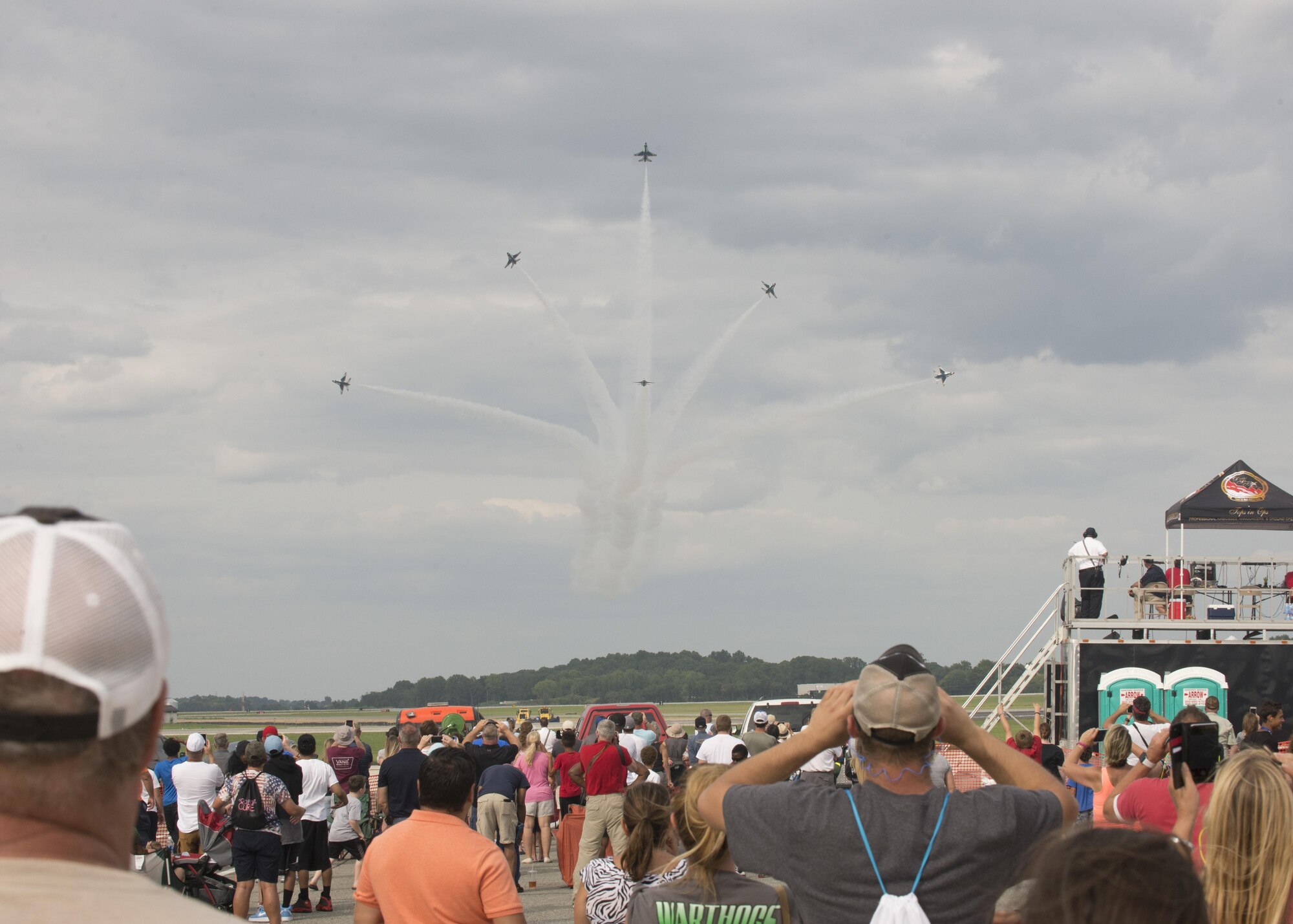 Team Dover guests watch as the Thunderbirds perform during the 2017 Thunder Over Dover Open House Aug. 27, 2017, on Dover AFB, Del. The Thunderbirds demonstrated the versatility of the F-16 Fighting Falcon by performing aerial acrobatics, precision formations and high-speed passes during their performance. (U.S. Air Force photo by Staff Sgt. Jared Duhon)