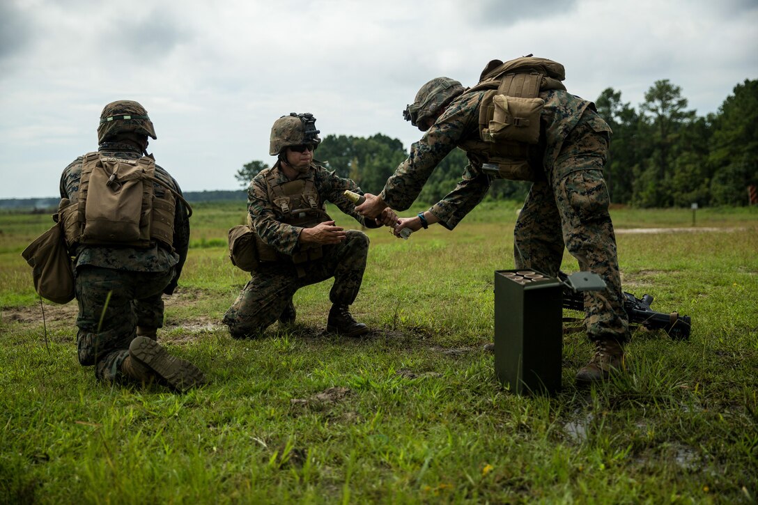 U.S. Marines with Battalion Landing Team 2nd Battalion, 6th Marine Regiment, 26th Marine Expeditionary Unit (MEU), handle a 60mm mortar during a mortar firing range as part of Realistic Urban Training (RUT) at Camp Lejeune, N.C., Aug. 21, 2017.