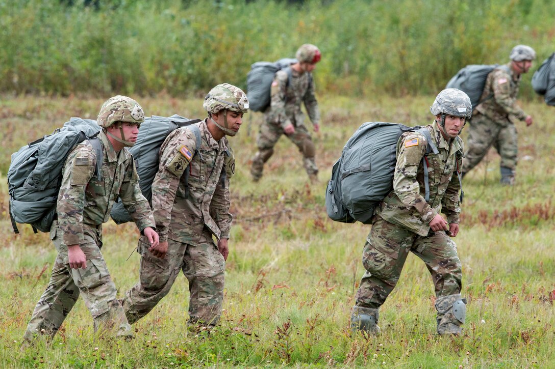 Soldiers walk to a rally point at Malamute Drop Zone during airborne training