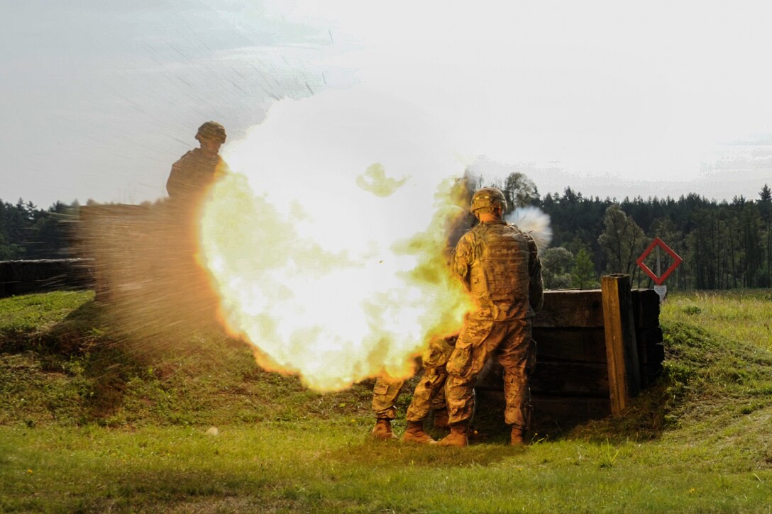 Soldiers fire an AT-4 rocket launcher during weapons familiarization