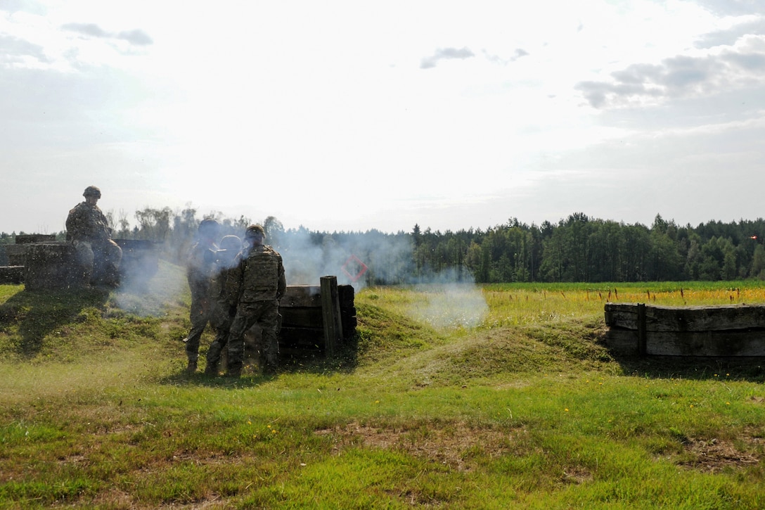 Soldiers fire an AT-4 rocket launcher during weapons familiarization trainin