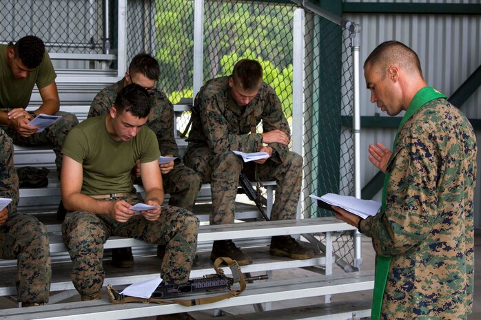 U.S. Navy Lt. Cmdr. John M. Mabus, a chaplain with the 26th Marine Expeditionary Unit (MEU), gives a sermon to Marines during Realistic Urban Training (RUT) at Camp Lejeune, N.C., Aug. 20, 2017.
