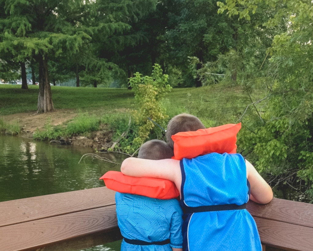 Liam, 5, and Jaiden, 8, take in the view after a long day of fishing at Nolin River Lake's Wax recreation area courtesy fishing pier.