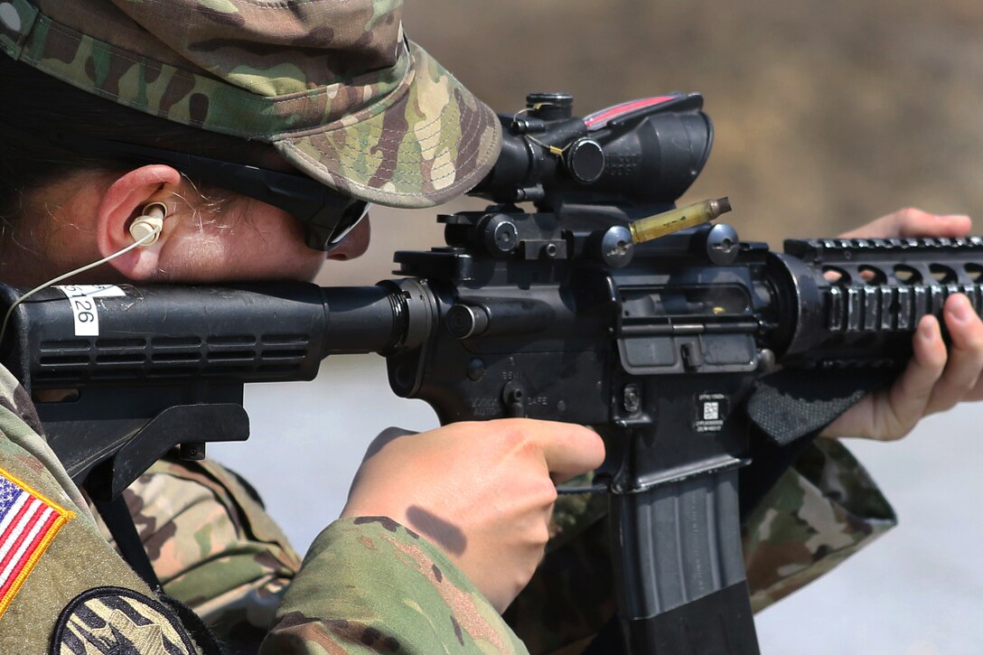 Army Sgt. 1st Class Hanan Khader fires an M4 Carbine during a Law Enforcement Weapons Training and Qualification range