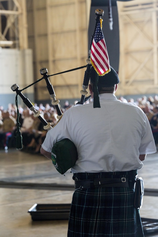 A bagpiper with the New York Fire Department Emerald Society Pipes and Drums performs a rendition of “Amazing Grace” during a memorial ceremony at Stewart Air National Guard Base in Newburgh, New York, Aug. 27, 2017. The memorial honored nine Marines from Marine Aerial Refueler Transport Squadron 452, Marine Aircraft Group 49, 4th Marine Aircraft Wing, Marine Forces Reserve, who were among 15 Marines and one sailor killed in a KC-130T accident on July, 10, 2017. (U.S. Marine Corps photo by Cpl. Dallas Johnson)