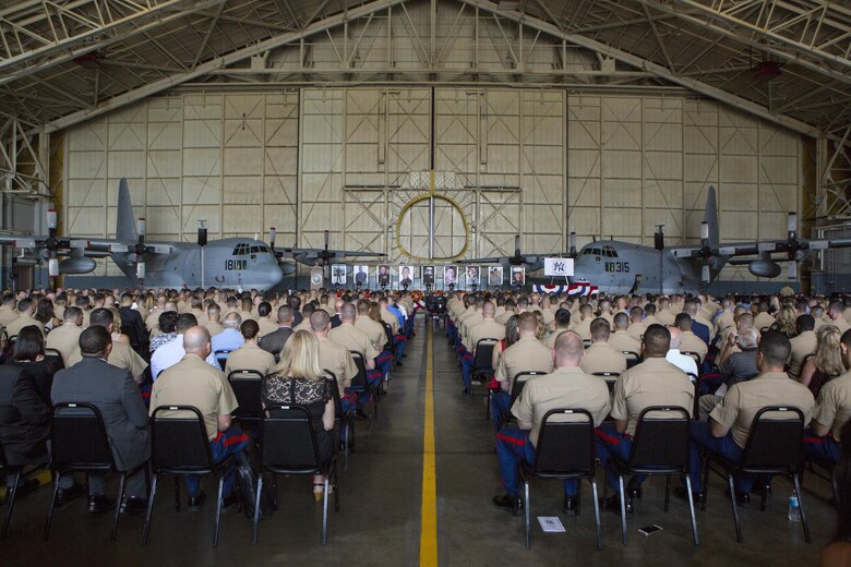 An audience waits for the invocation of a memorial ceremony to honor nine Marines from  Marine Aerial Refueler Transport Squadron 452, Marine Aircraft Group 49, 4th Marine Aircraft Wing, Marine Forces Reserve, at Stewart Air National Guard Base in Newburgh, New York, Aug. 27, 2017.