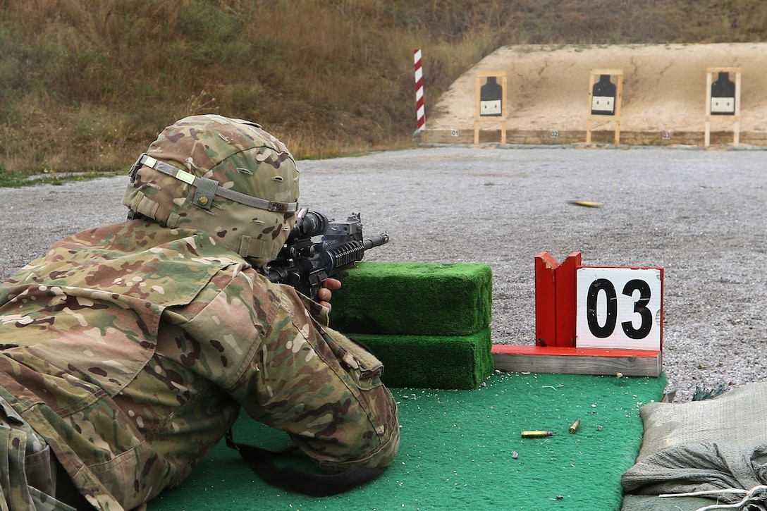 A soldier fires his M4 carbine during the zeroing portion of the M4 qualification range