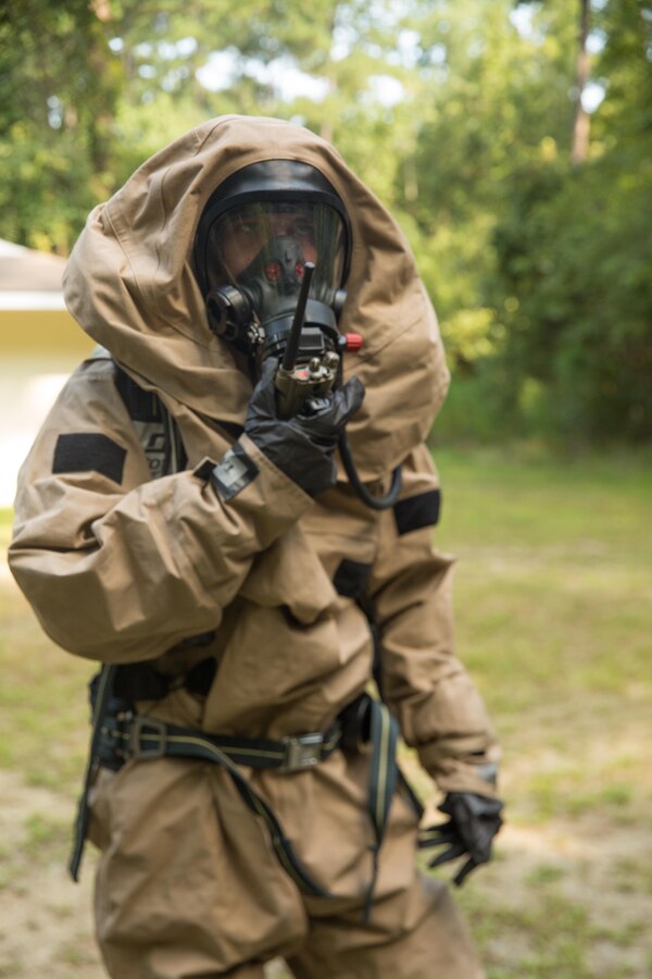 U.S. Marine Corps Efrain H. GonzalezOrtiz, a chemical, biological, radiological, and nuclear defense specialist with the 26th Marine Expeditionary Unit (MEU), communicates with his unit leader prior to performing assessment and consequence management training at Camp Geiger, N.C., Aug. 18, 2017. The 26th MEU conducted the training as part of Realistic Urban Training (RUT), an exercise designed for the Marines to gain operational experience in an urban environment prior to an upcoming deployment. (U.S. Marine Corps photo by Lance Cpl. Jered T. Stone)