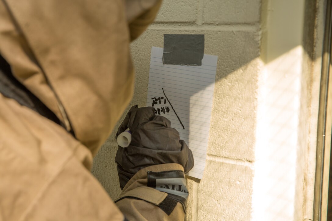 U.S. Marine Corps Cpl. Efrain H. GonzalezOrtiz, a chemical, biological, radiological, nuclear defense specialist with the 26th Marine Expeditionary Unit (MEU), annotates findings during assessment and consequence management training at Camp Geiger, N.C., Aug. 18, 2017.