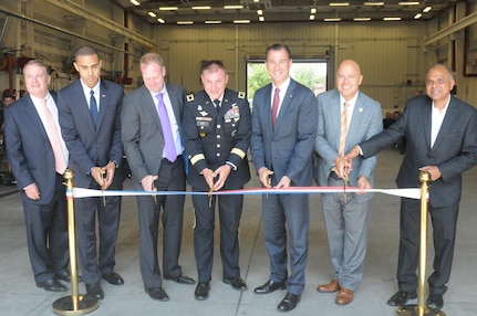 The U.S. Army Reserve’s 99th Regional Support Command hosted a ribbon-cutting ceremony Aug. 17 for the Area Maintenance Support Activity, Organizational Maintenance Shop, on Fort Totten, New York. Major Gen. Troy D. Kok, commanding general of the 99th RSC, center, cut the ribbon at the revitalized facility in Fort Totten. U.S. Congressman Thomas R. Suozzi and New York City Council Member, 19th District, Queens, Paul A. Vallone are third and second from right. The center underwent a $12.6 million full-facility revitalization, allowing technicians to perform in an up-to-date facility to meet readiness standards as well as train military unit mechanics as needed so they can perform maintenance while they’re deployed.