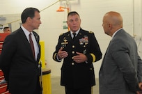 Maj. Gen. Troy D. Kok, commanding general of the U.S. Army Reserve’s 99th Regional Support Command, speaks with U.S. Congressman Thomas R. Suozzi and New York City Council Member, 19th District, Queens, Paul A. Vallone at the ribbon-cutting ceremony Aug. 17 for the revitalized AMSA/OMS (Area Maintenance Support Activity/Organizational Maintenance Shop) in Fort Totten. The center underwent a $12.6 million full-facility revitalization, allowing technicians to perform in an up-to-date facility to meet readiness standards as well as train military unit mechanics as needed so they can perform maintenance while they’re deployed.