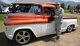 Brig. Gen. Steven J. Bleymaier, Ogden Air Logistics Complex commander, presents the Generals Choice Award to Jake Dominguez, 709th Maintenance Support Squadron electronics mechanic, for his custom pearl white and tangerine, 1955 Chevrolet pickup. (U.S. Air Force photo by Alex R. Lloyd)