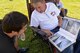 Curtis Welter, Ogden ALC quality assurance, takes a moment to show off pictures and talk about his 1971 El Camino SS during the annual Ogden Air Logistics Complex summer picnic and car show. (U.S. Air Force photo by Alex R. Lloyd)
