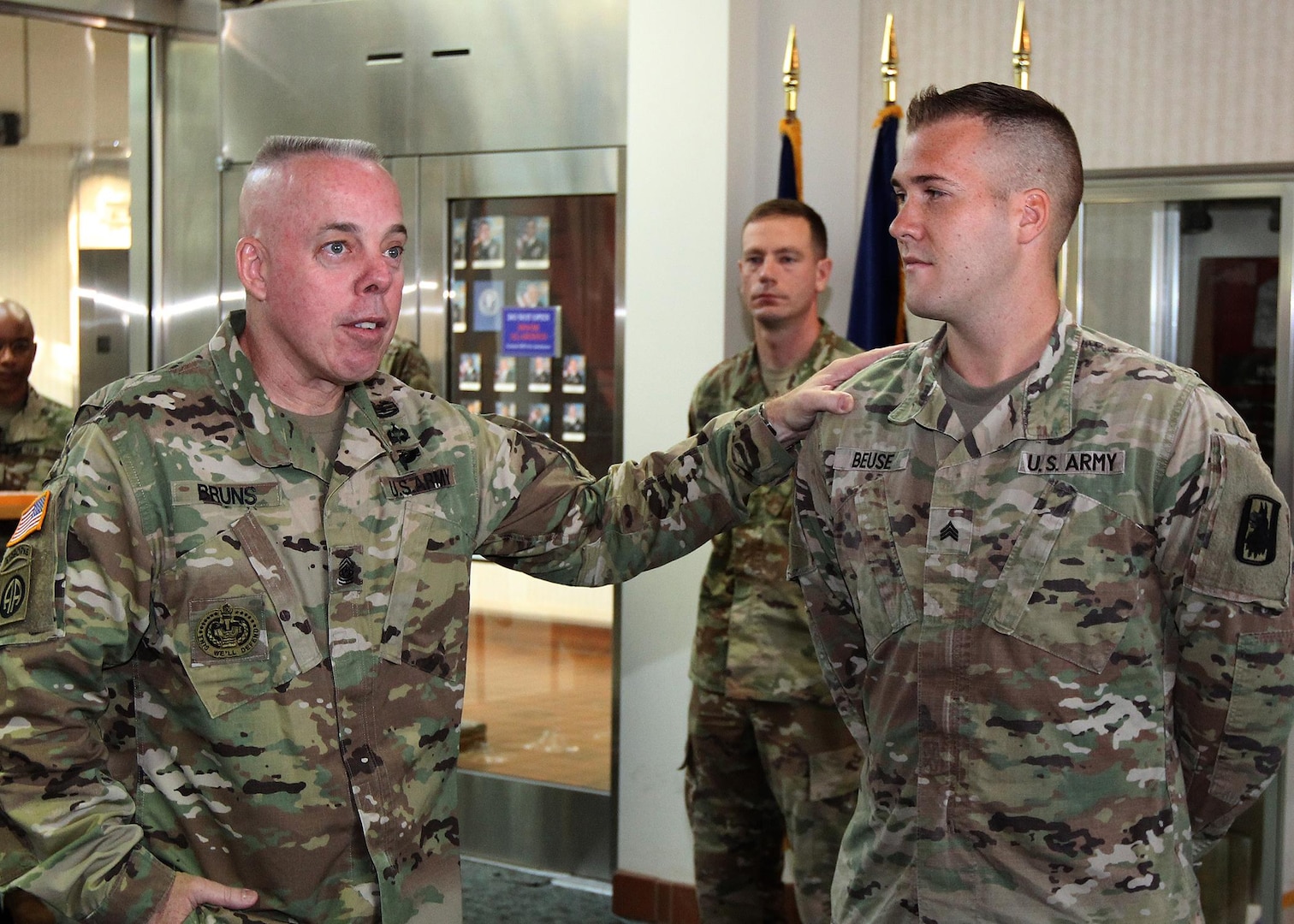 Command Sgt. Maj. William Bruns, the U.S. Army Cyber Command command sergeant major (left), congratulates Sgt. Kevin Beuse of Colorado Springs, Colo., assigned to Headquarters & Headquarters Company, 470th Military Intelligence Brigade, U.S. Army Intelligence and Security Command, Joint Base San Antonio-Fort Sam Houston, for earning the title of 2017 ARCYBER Best Warrior Non-commissioned Officer of the Year, at an award ceremony in the command’s headquarters at Fort Belvoir, Va., Aug. 25. Beuse will represent ARCYBER at the Army-level BWC in October.