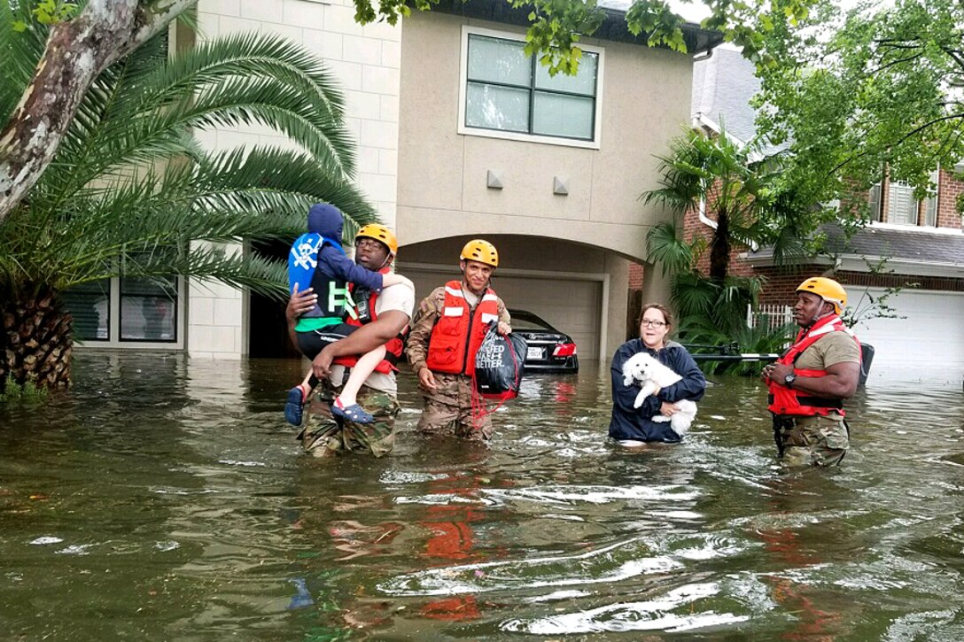 Texas Army National Guardsmen assist residents affected by flooding caused by Hurricane Harvey