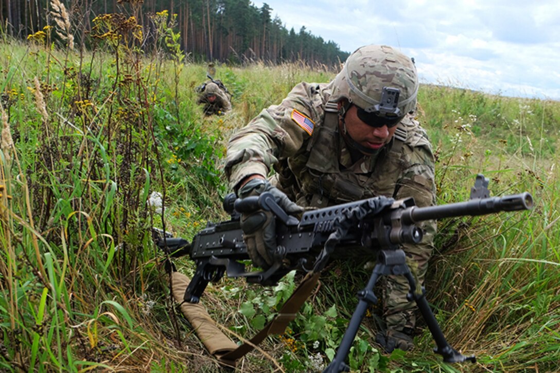 A soldier from the U.S. scout platoon, Battle Group Poland, prepares for an upcoming live-fire exercise.