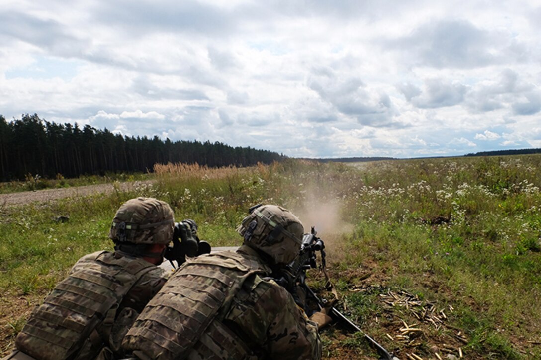 American soldiers from the scout platoon, Battle Group Poland, conduct maneuvers