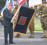 Retired Master Sgt. Vernon Schmidt, a 91-year-old surviving member of the 90th Infantry Division’s from World War I, places a streamer on the 90th ID’s flag during the Fort Sam Houston’s World War I Centennial Ceremony honoring the 90th ID inside the historic Quadrangle at Fort Sam Houston, Texas. The uncasing and commemoration ceremony occurred 100-years to the day that the 90th Division activated at Camp Travis, what is now Fort Sam Houston.