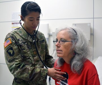 Maj. Amy Yau, an internal medicine physician, listens to Rebecca Haley's heartbeat during a routine checkup Aug. 25 at Brooke Army Medical Center, Joint Base San Antonio-Fort Sam Houston.