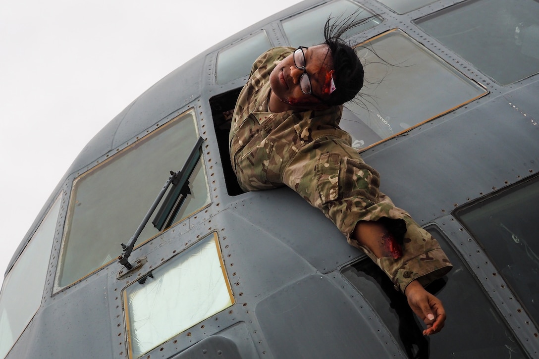 Army Sgt. Octavia Harrison role-plays as a mock casualty during exercise Patriot Warrior.