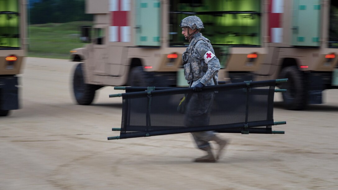 A soldier runs stretchers during exercise Patriot Warrior.