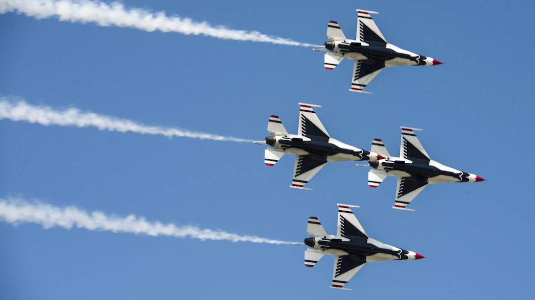 Four aircraft fly in a diamond formation.