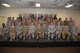 Col. Tricia Van Den Top, 90th Mission Support Group Commander and Chief Master Sgt. Christopher Pollock Steagall, 90th Mission Support Group command chief pose for a group photo with enlisted Airmen who promoted in July and August during the wing promotion ceremony on F.E. Warren Air Force Base, Wyo., Aug. 25, 2017. Each month the Mighty Ninety hosts a ceremony to recognize the promotees from the base. (U.S. Air Force photo by Glenn S. Robertson)