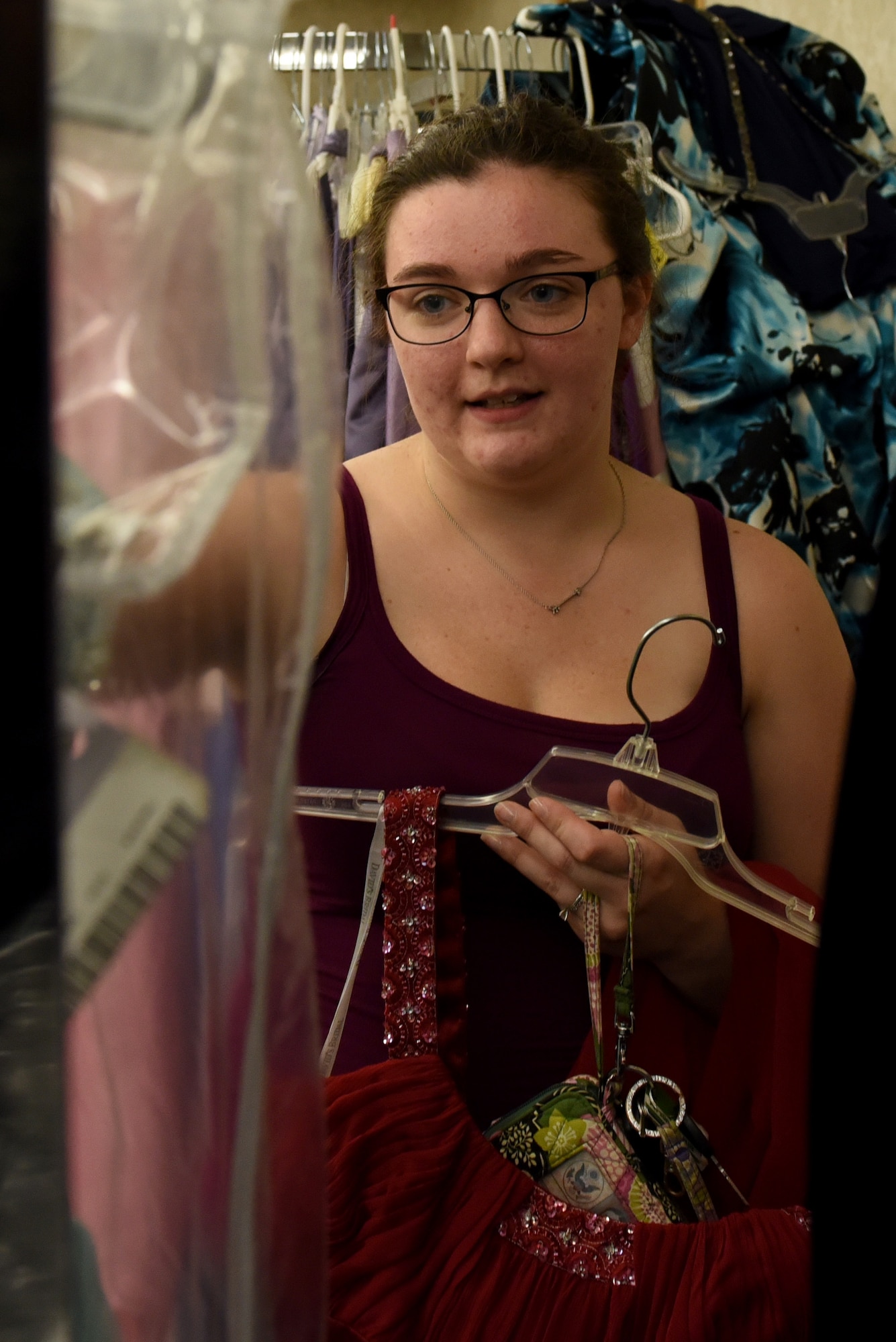 Katie Everett browses through the selection of evening gowns at the Cinderella’s Closet program, Aug. 23, 2017, at Seymour Johnson Air Force Base, North Carolina.