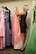Kristina Balboa, Cinderella’s Closet organizer, re-racks a gown at the Cinderella’s Closet program, Aug. 23, 2017, at Seymour Johnson Air Force Base, North Carolina.